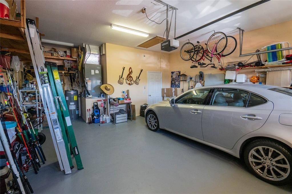 nice garage with lots of storage areas built in.