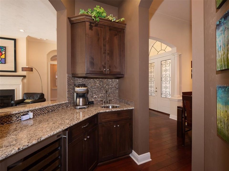 WET BAR AREA THAT BRIDGES DINING TO LIVING AREAS