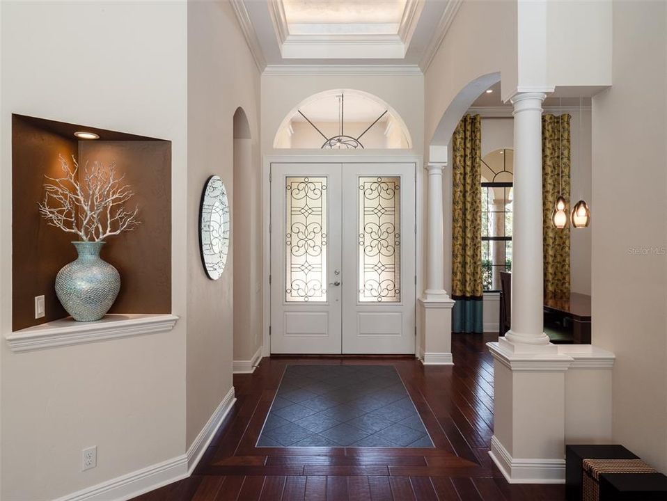 GRACIOUS FOYER HIGHLIGHTING WOOD FLOORS, 12 FOOT CEILINGS