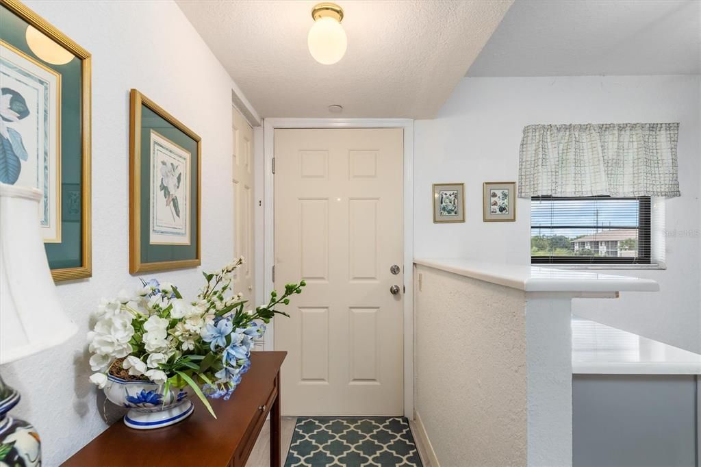 Welcoming entryway to this light and bright home
