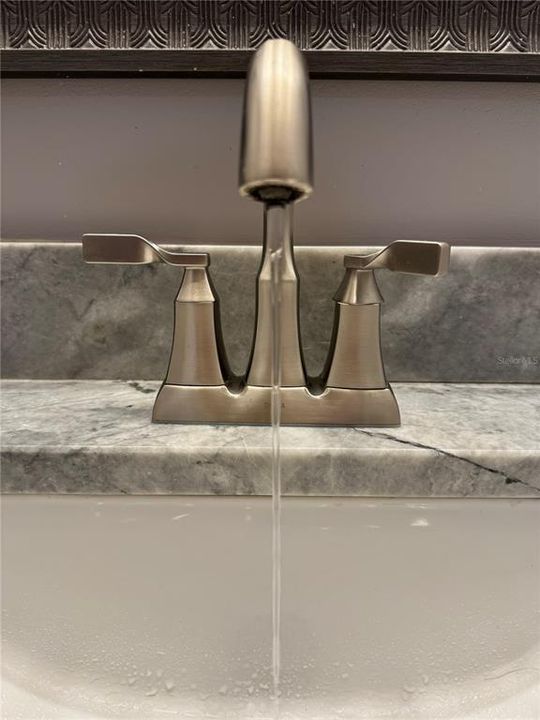 Natural stone countertops, Delta faucet