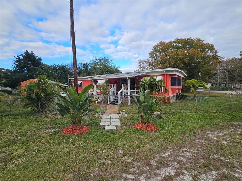 Walk through gate to front entrance