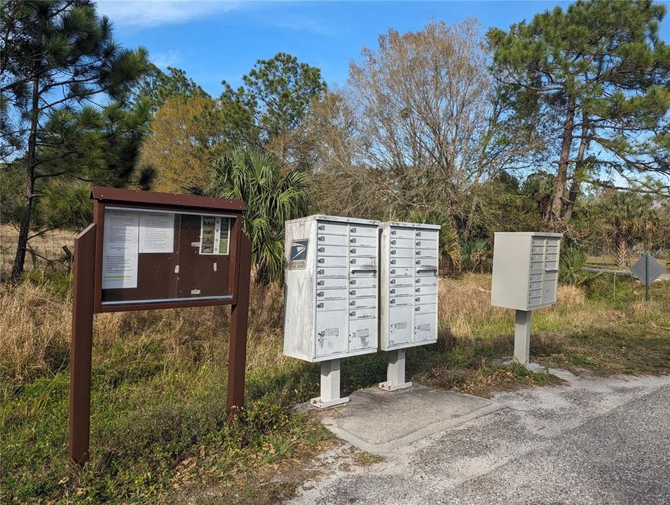 Community board and mailboxes.