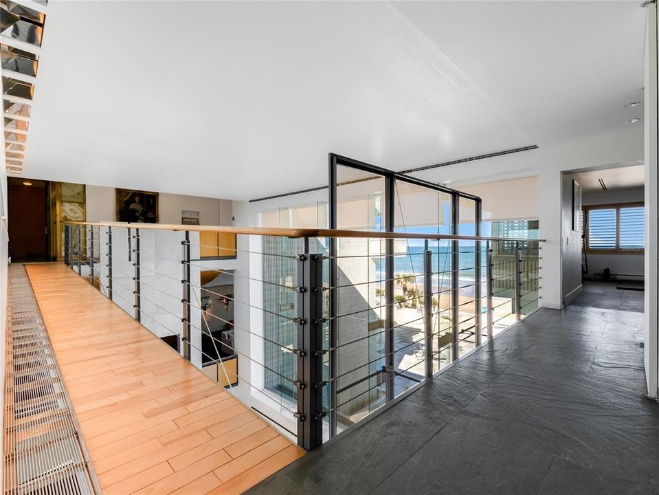 3rd floor landing with spectacular views, leading to the Workout room with Sauna and a bridge to the Owners Suite.