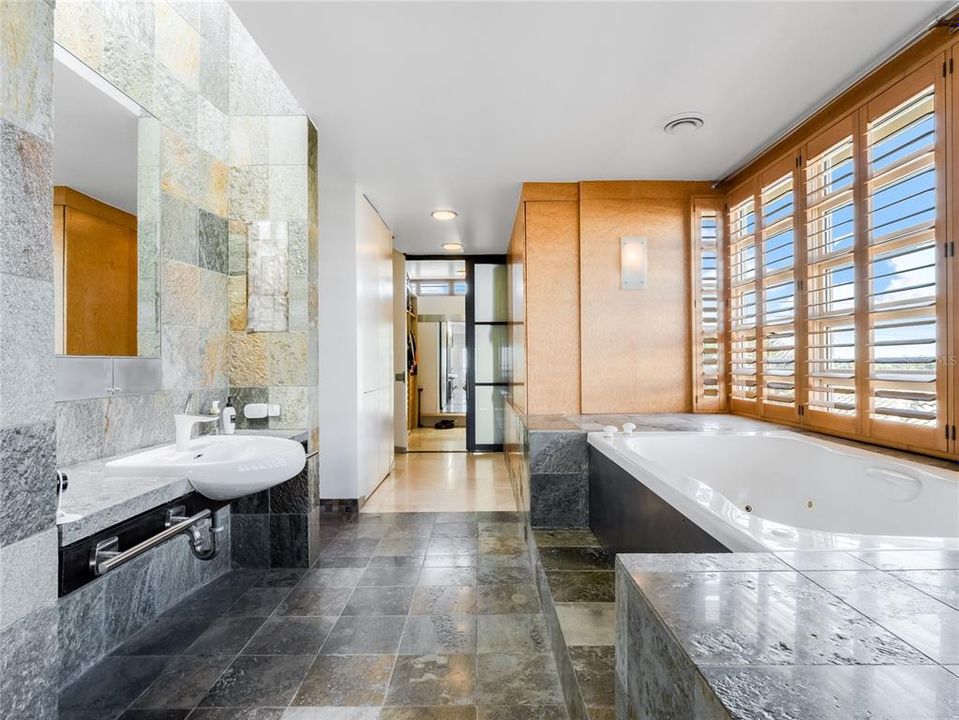 The luxurious spa-like bathroom is the perfect place to unwind and relax after a long day.
