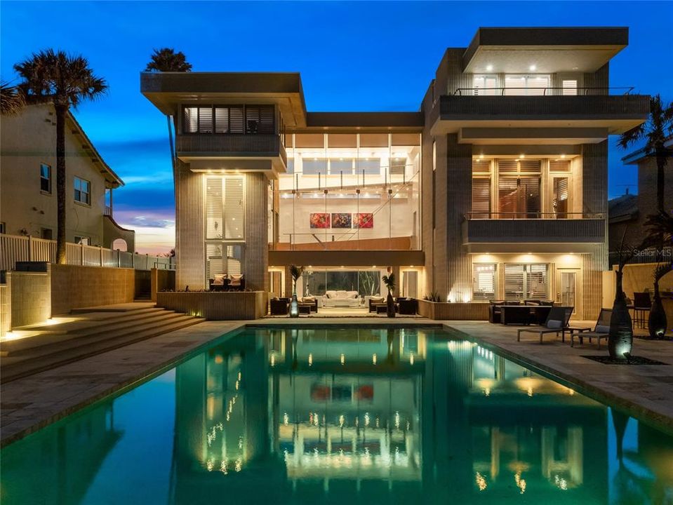 This three-story modern retreat is the epitome of elegance and sophistication.