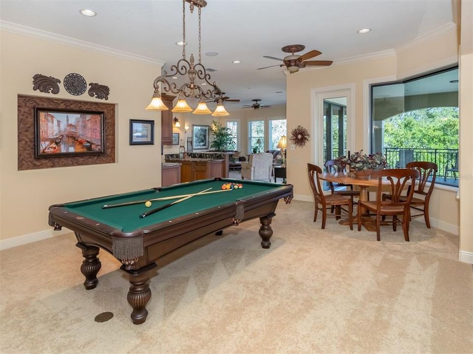 Billiards room upstairs with water views