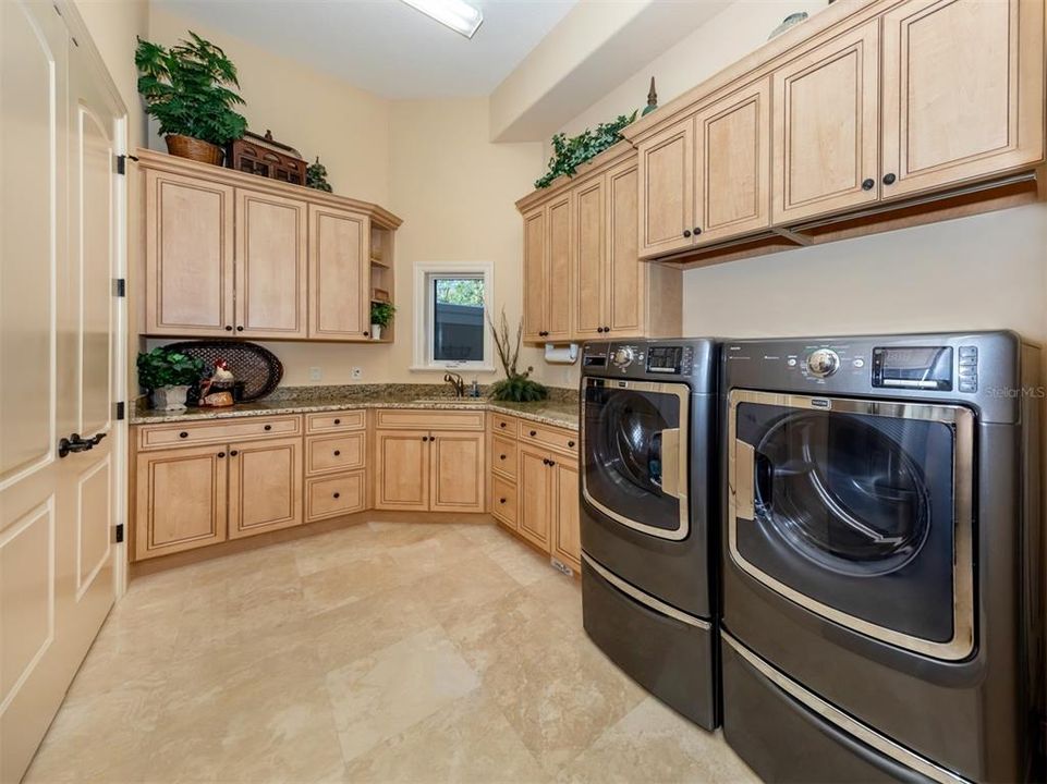 Laundry room with inside storage room