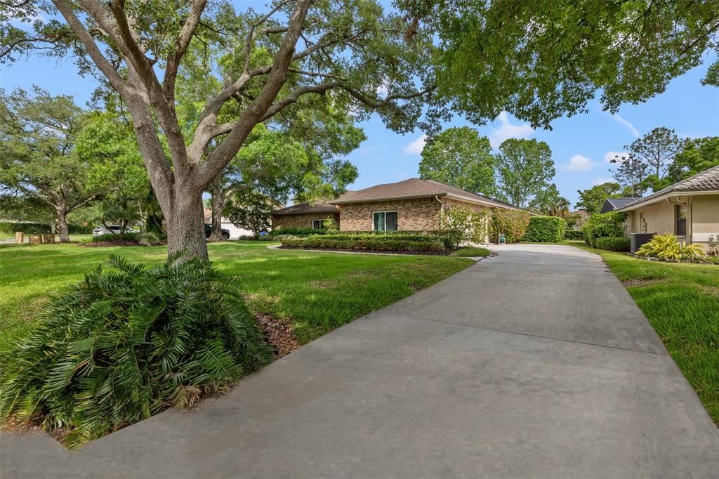 Long driveway and entrance with 2 car garage