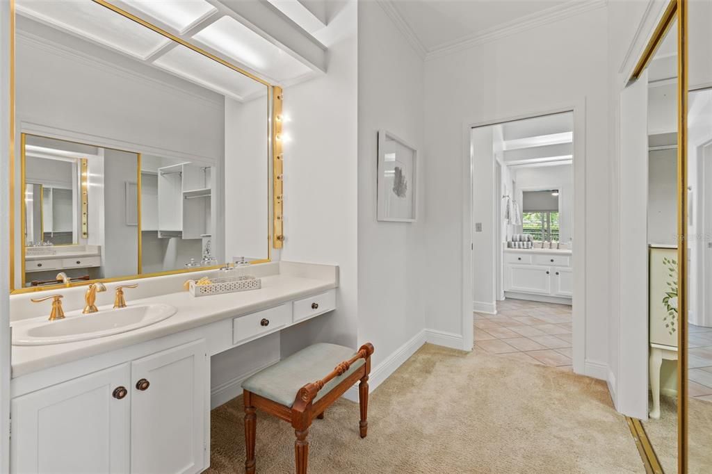 Alternate angle - first sink with bench/stool, vanity and full length mirror