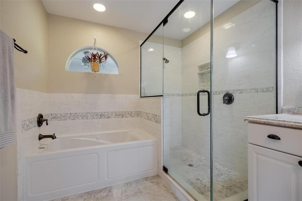Primary Bathroom with separate shower and Jetted Tub.