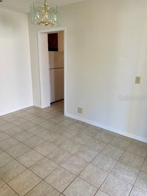 Dining Area (11.8 x 7 ft) leads to the Kitchen