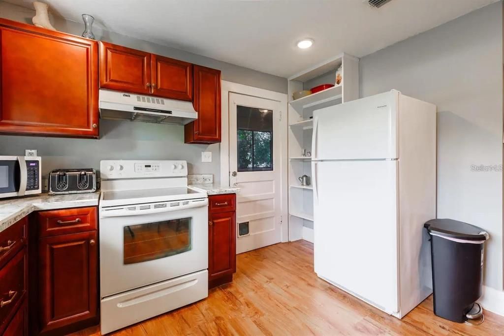 Apt 4 renovated kitchen with door to private laundry