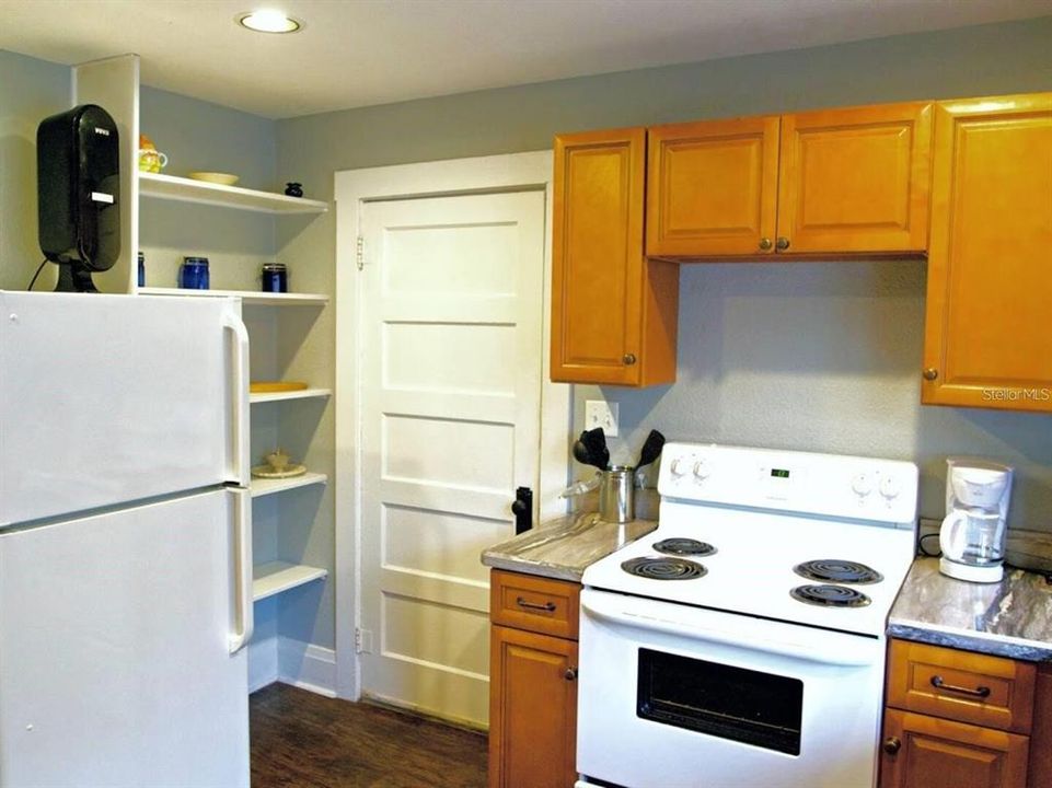 Apt 1 renovated kitchen with door to private laundry