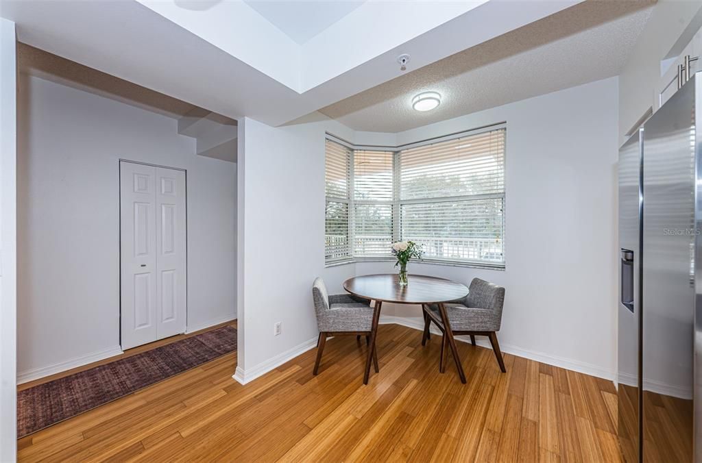 Breakfast nook looks out on to front balcony and pond views.