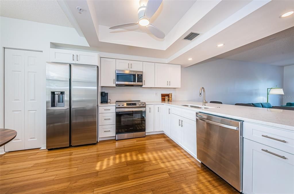 Fabulously updated kitchen- quartz counter, shaker cabinets, soft close doors, and stainless appliances- completed in 2022
