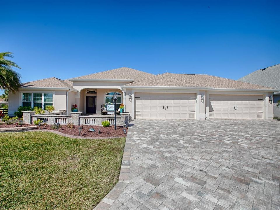 Just LOOK at this HUGE, custom paver driveway and private, gated courtyard!