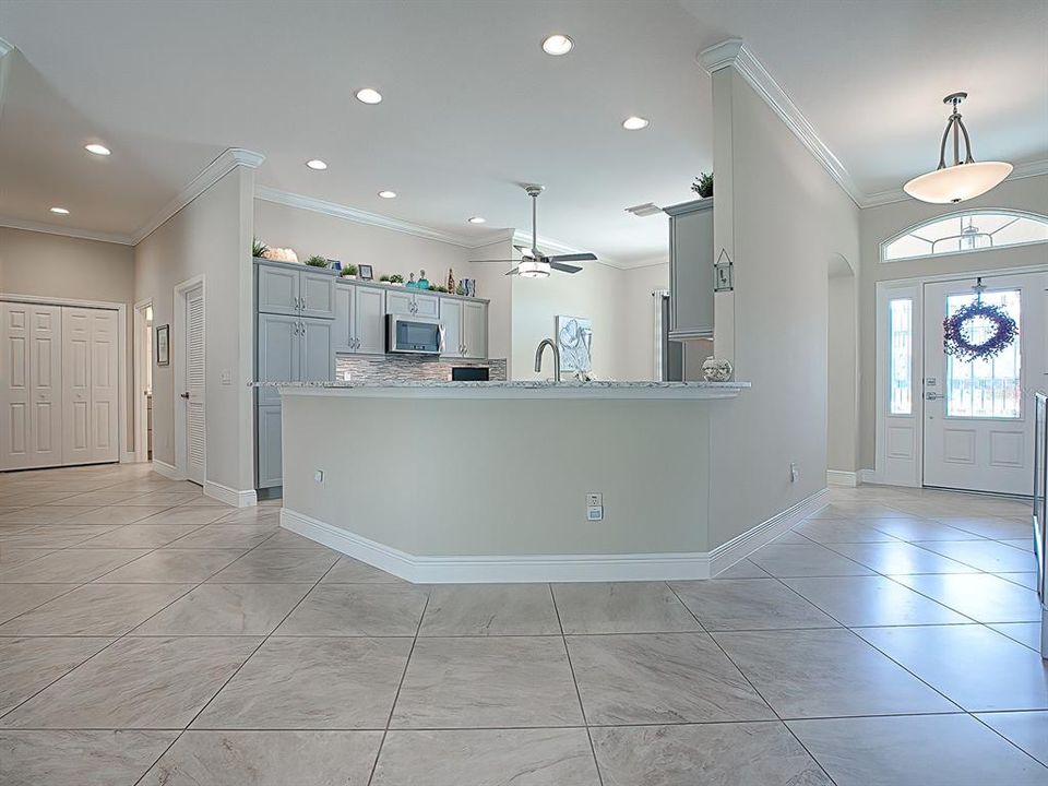 HUGE, open kitchen with Alpine Gray cabinets, sets a modern/updated tone