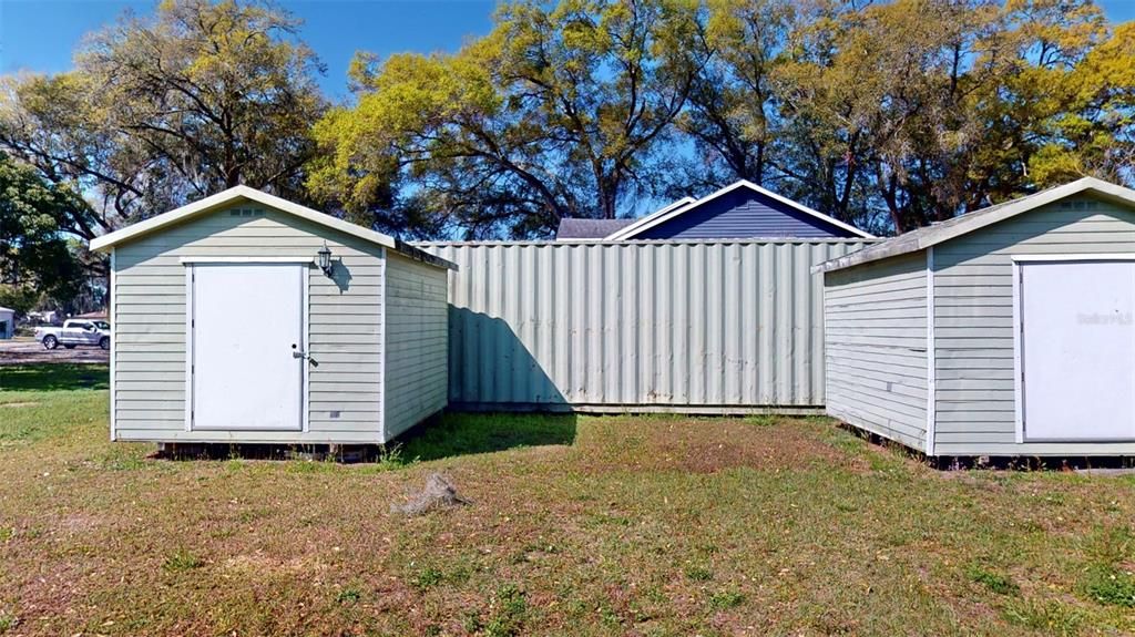 2 sheds included in the sale, not container