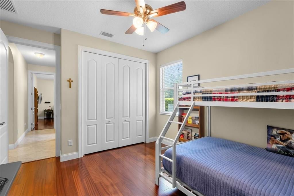 bedroom 2 with large closet and hardwood flooring