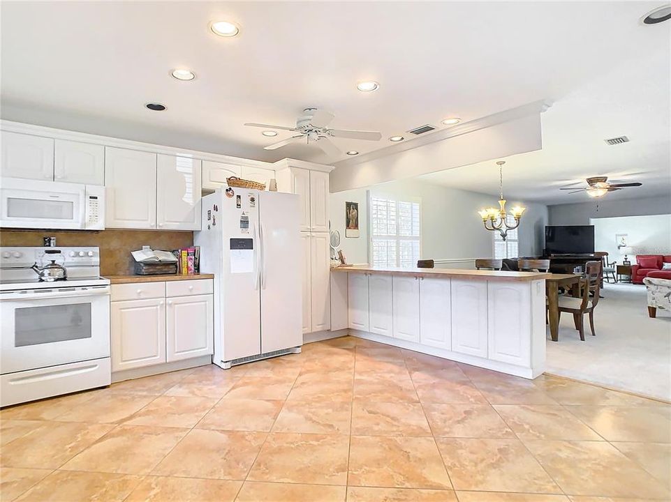 The kitchen is open to the living room and dining area, perfect for entertaining.
