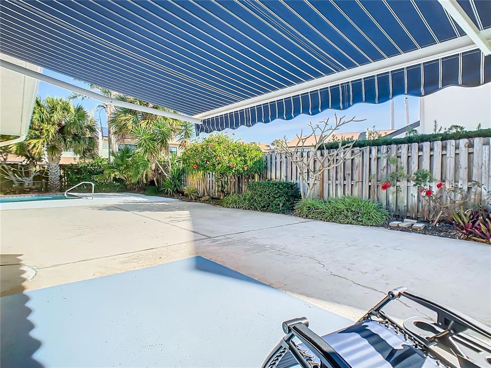 Enjoy your tropical oasis under the large retractable awning.