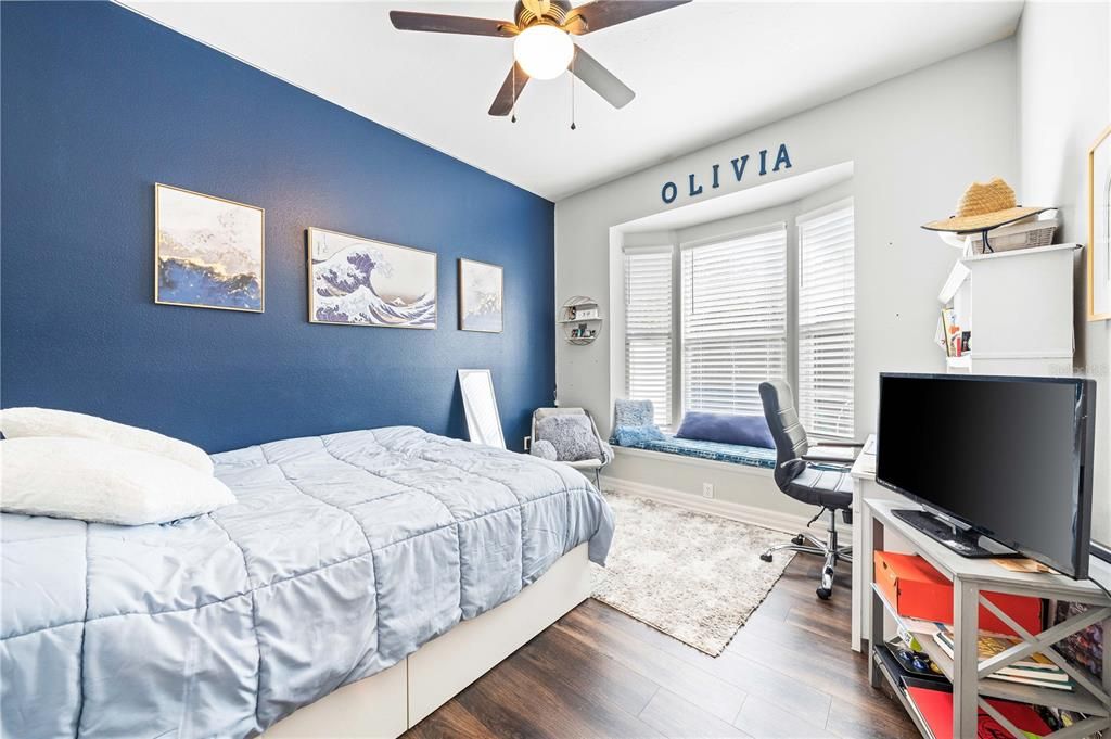 Guest bedroom with window seat and  walk in closet