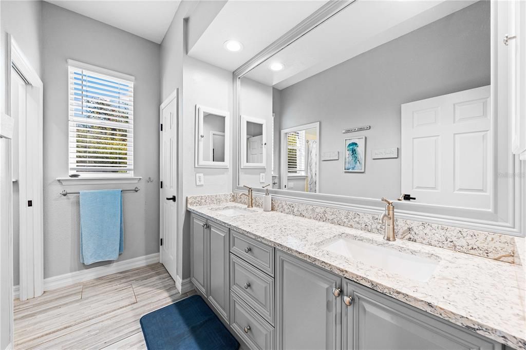 Guest bath with dual vanities and quartz counters