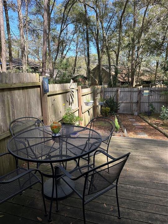 Back patio and fenced yard