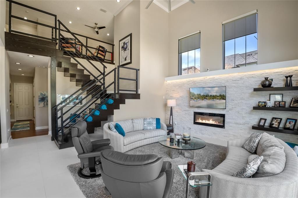 Loft view of Family Room, Kitchen and Nook with Pool in the background.