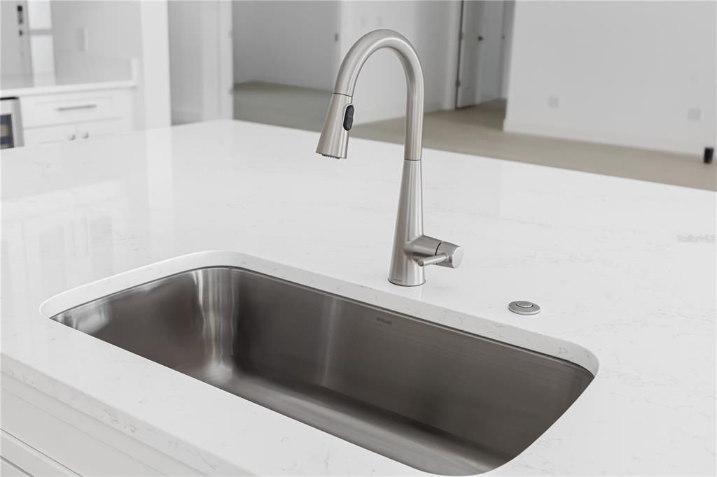 Large undermount sink with garbage disposal.