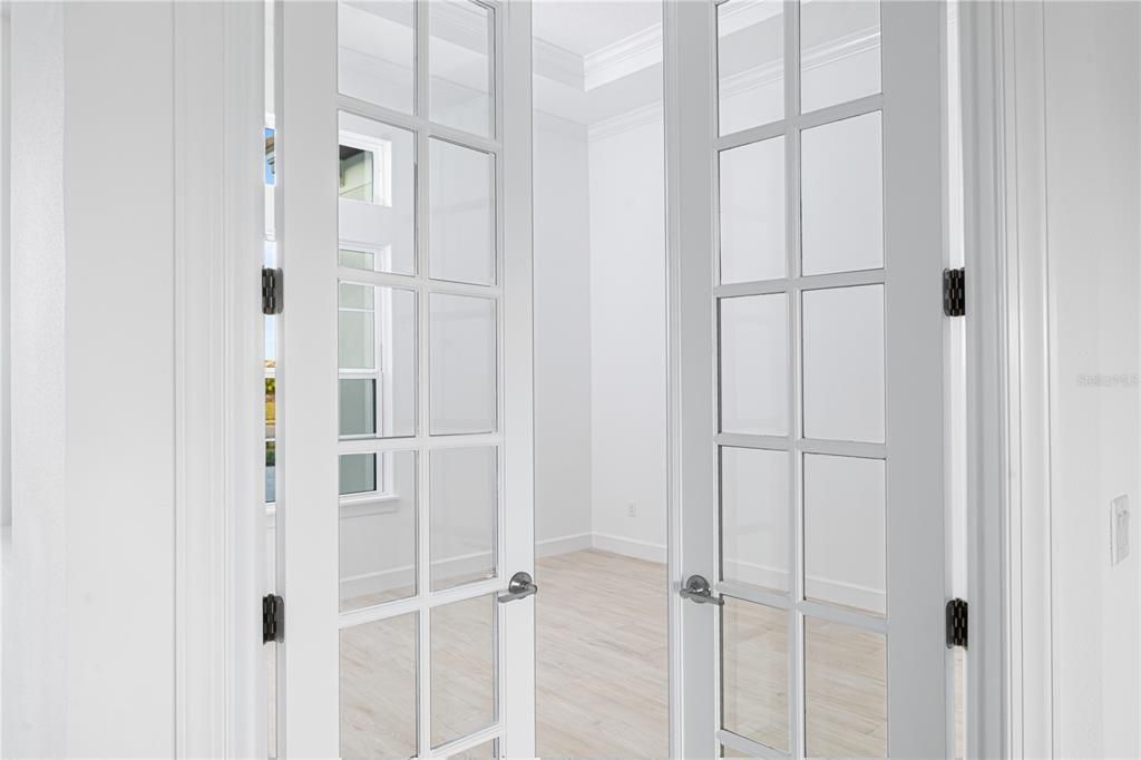 Double French Doors Open to a private office