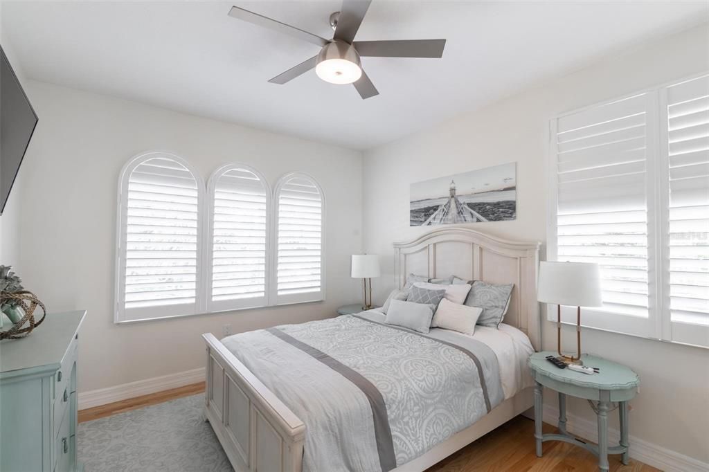 Guest bedroom with plantation shutters