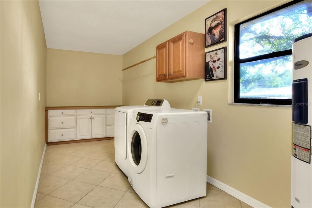 Large laundry/hobby room.