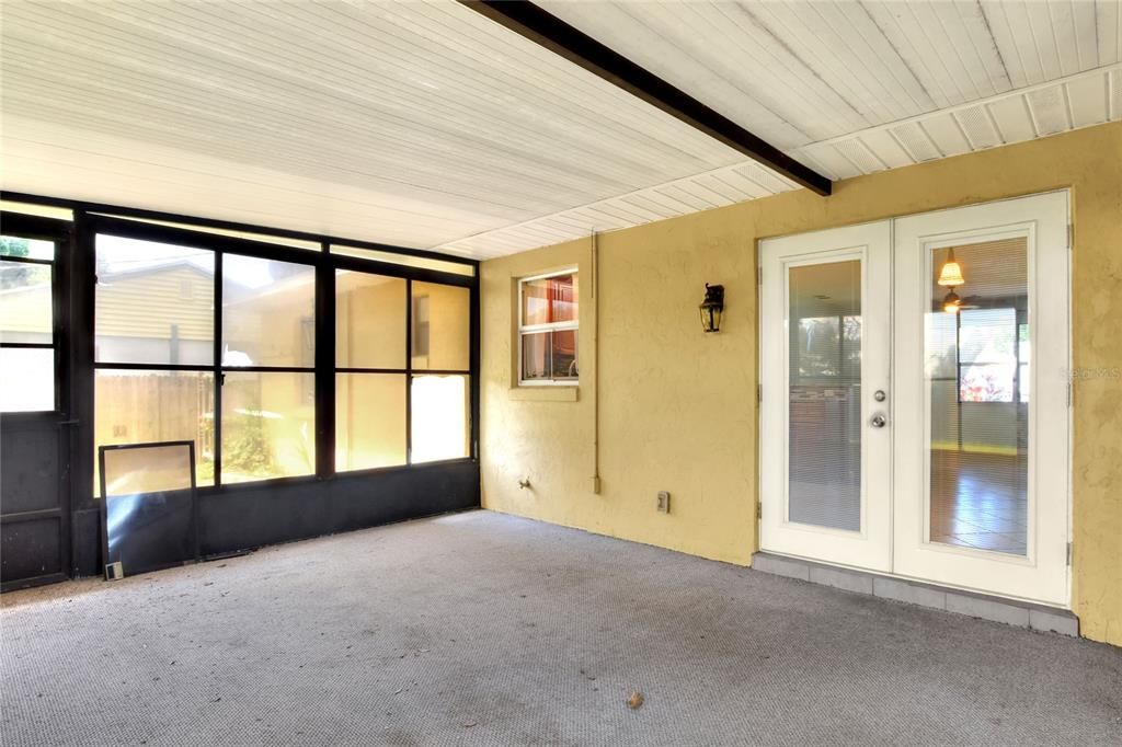 Spacious screened porch  with vinyl windows.