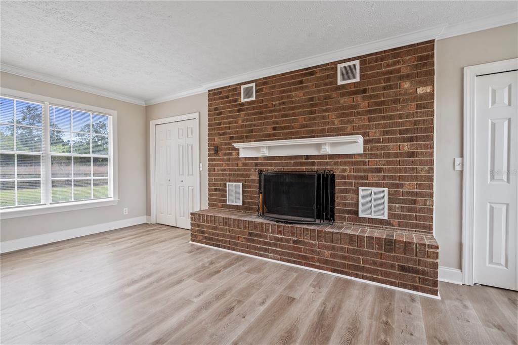 Living room with fireplace and additional storage