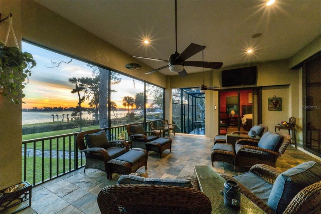 Oversized screened lanai to soak in sunrises and sunsets... Also a slider from the Primary bedroom to the lanai