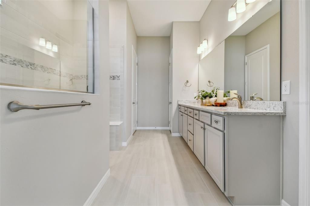 Beautiful primary bathroom with dual vanity and large walk in shower