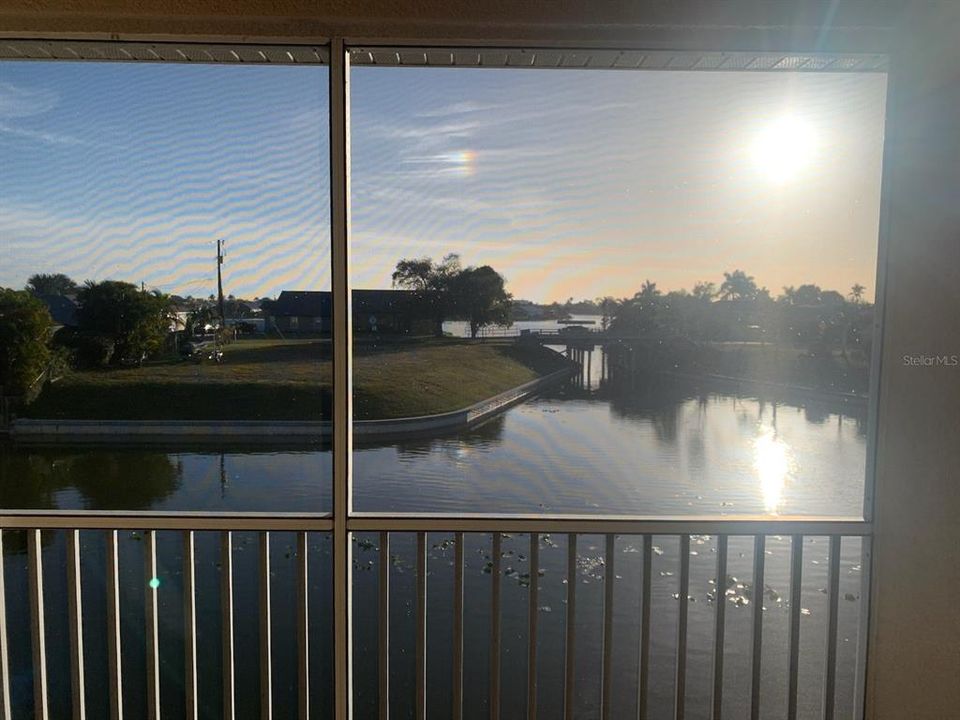sunrise on intersecting canal from private balcony
