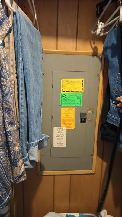 Electrical panel is located in the built in closet in the Primary Bedroom