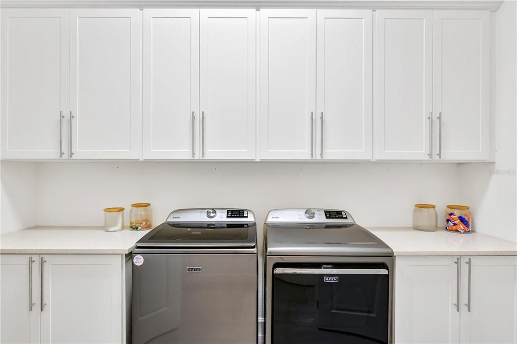 So much Storage in this Laundry Room and Two Counters for folding clothes!