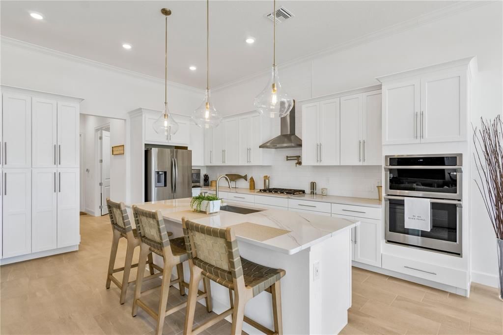 Spacious Gourmet Kitchen w/Built-In Pantry Cabinets and Double Ovens.