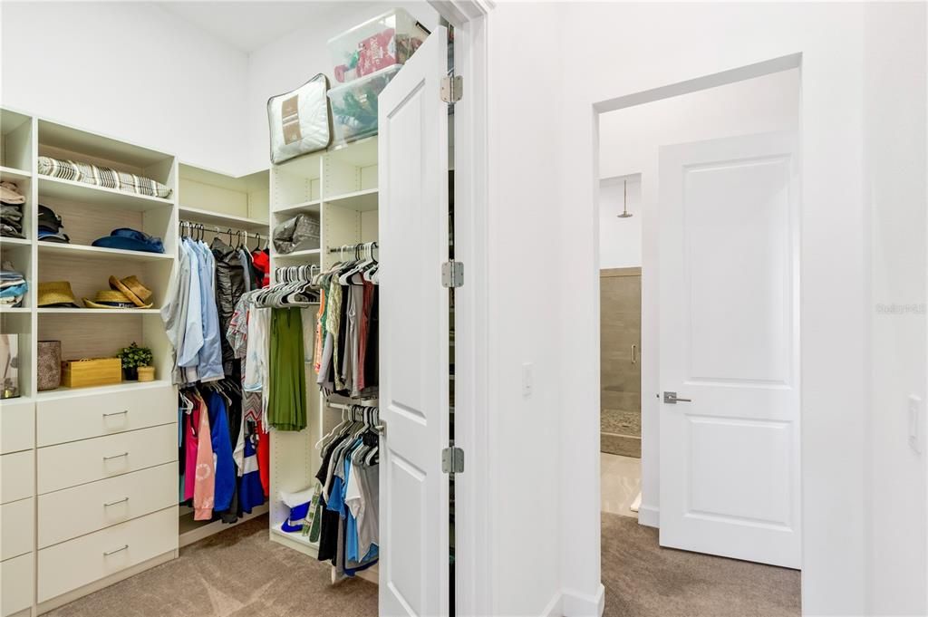 View of Master Bedroom Closet leading to the Master Bathroom.