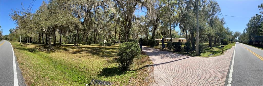 Steet view:  Not a corner lot. (panoramic photo makes it appear it is on a corner).