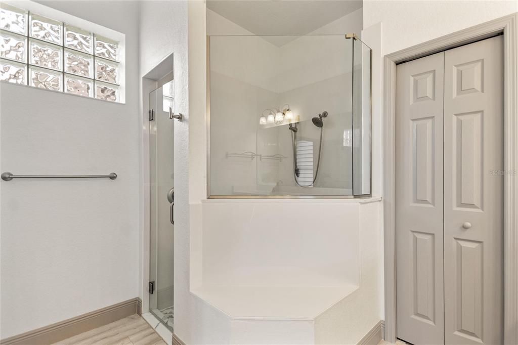 Large spacious shower and linen closet in master bathroom