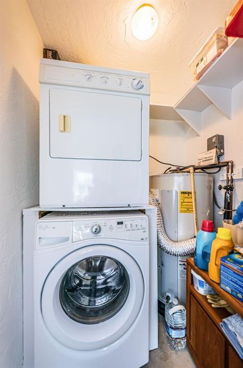 Washer and dryer located off enclosed Florida Room has small pantry to the right.