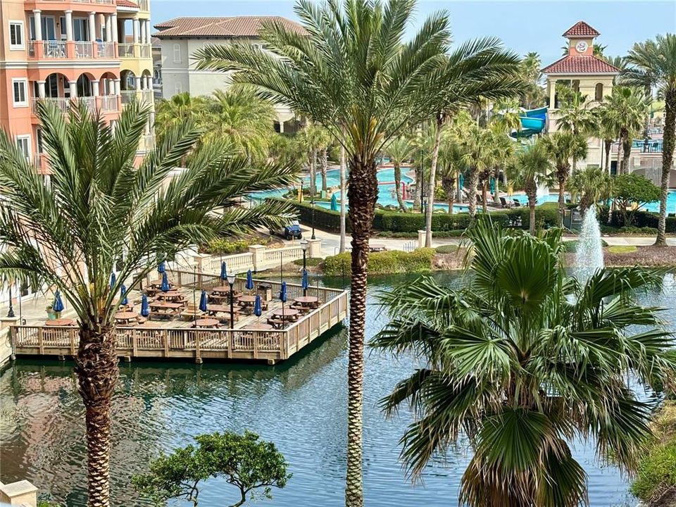 Lake with outdoor cafe seating.