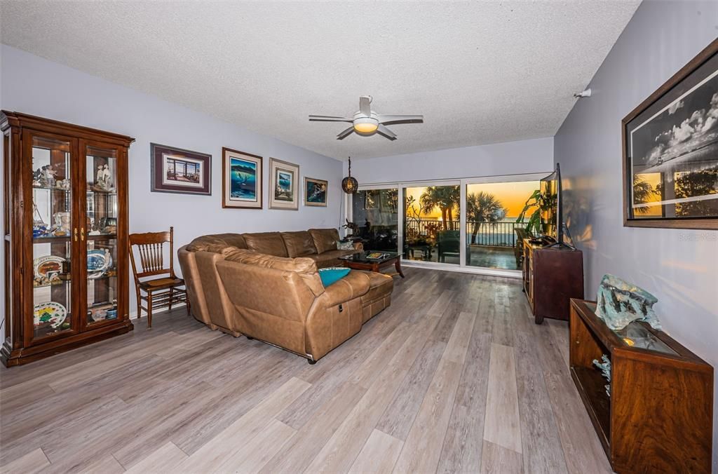 ..SUNSET SHOTS ..Sitting Area in Living Room. 8.7 Ceiling Heights. New Floors- New Kitchen - New Wet Bar - High Impact Sliders - Small Private 7 Unit Complex.. First Floor Unit has Stairs from Balcony to Pool Areas..