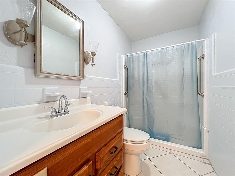 Guest bathroom has been updated and has a walk-in shower.