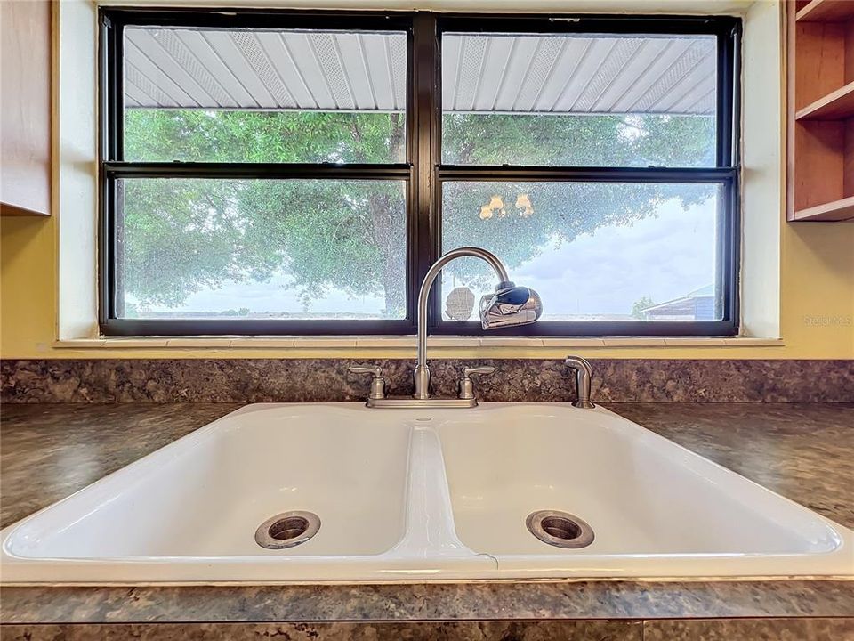 The window over the kitchen sink allows a nice back-yard view.